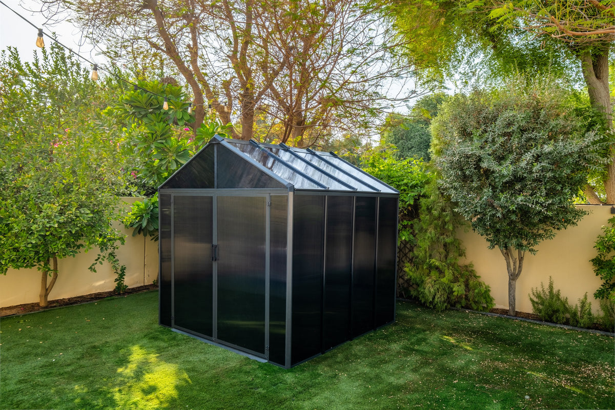 Domer Standard Slate grey shed with Black profile, shown from the front and side in a garden. #Profile colour_Black