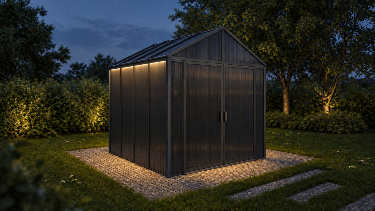 DOMER Slate Shed with black profiles in a garden at dusk with warm lighting #Profile colour_Black