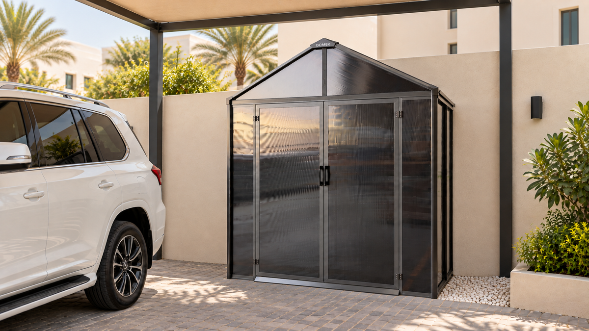DOMER Smart Midnight Shed with black opaque walls and translucent roof in a villa carport